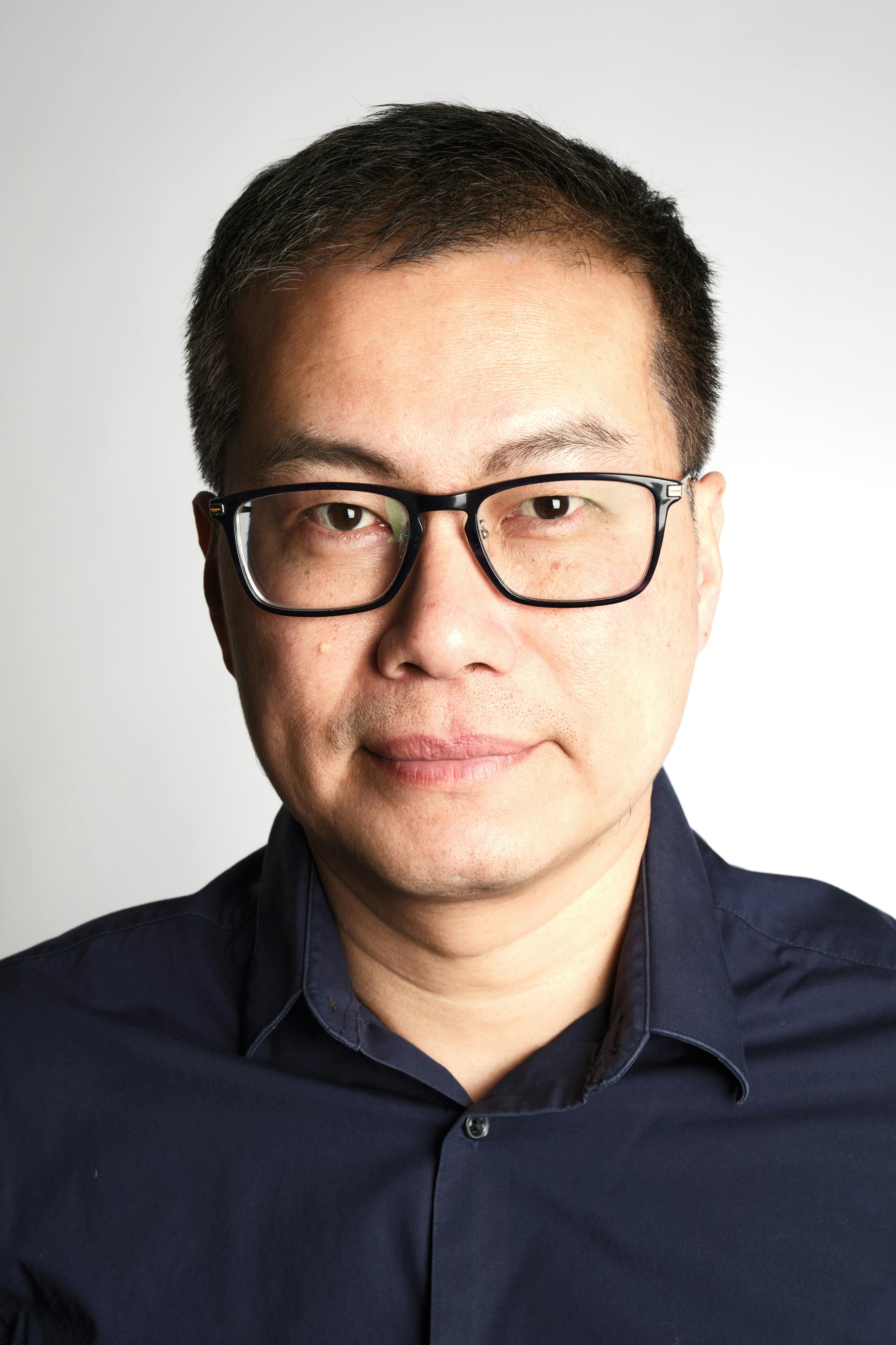 man standing beside wall