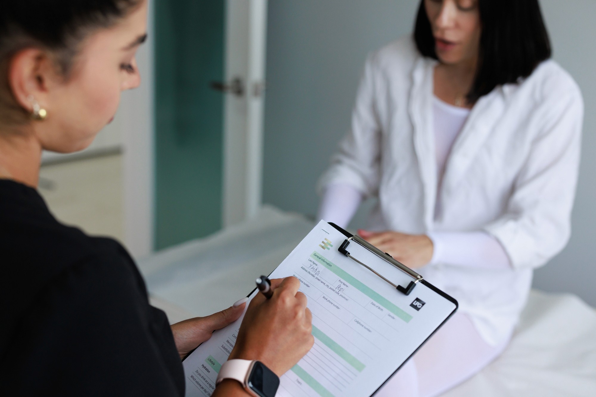 Beautician and patient in consultation