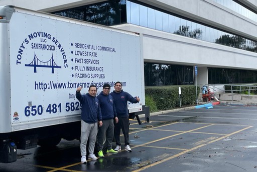 Tony’s Moving Services crew standing beside truck