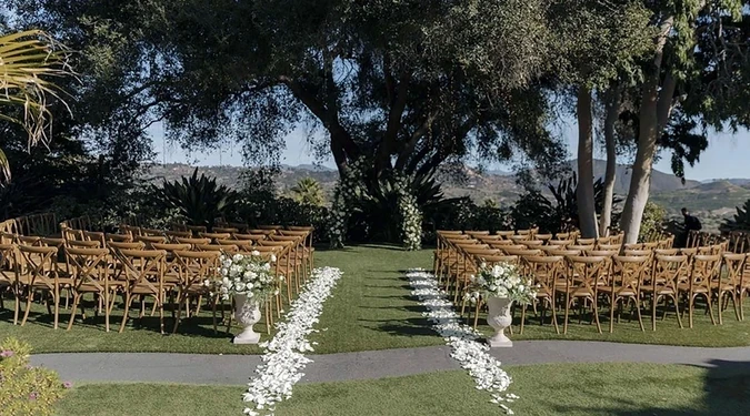 Tivoli Italian Villa wedding ceremony space with trees, outdoor seating, and garden setting in Vista California