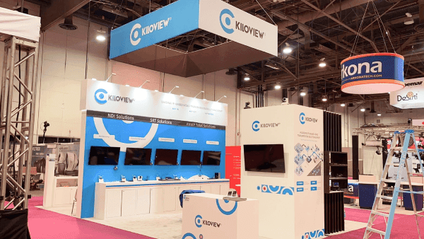 Kiloview NAB Show 20x20 screen-led demo booth with video workflow displays, branded wall graphics, demo counters, and compact visitor flow