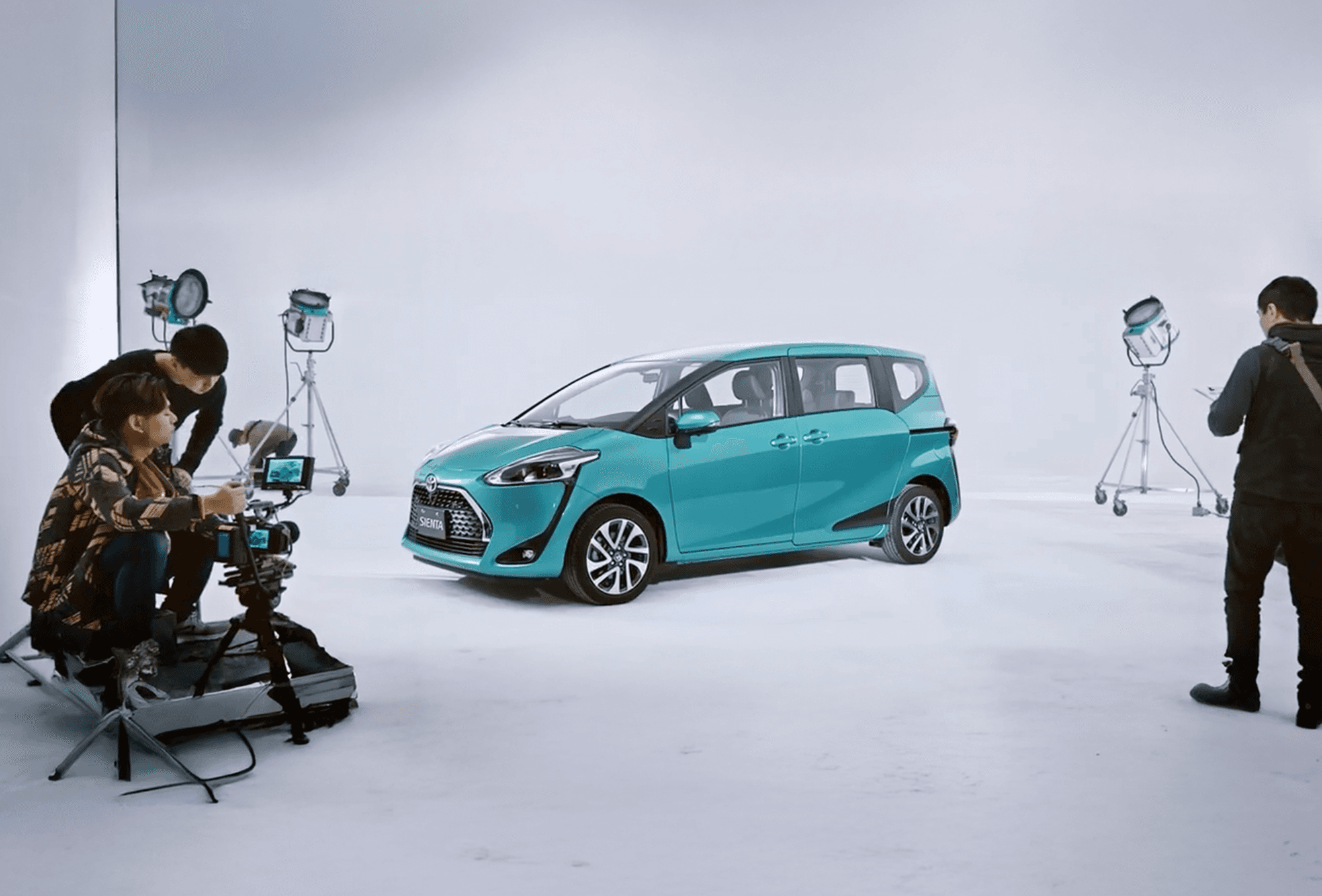Cafe window display with ornate wallpaper and seating