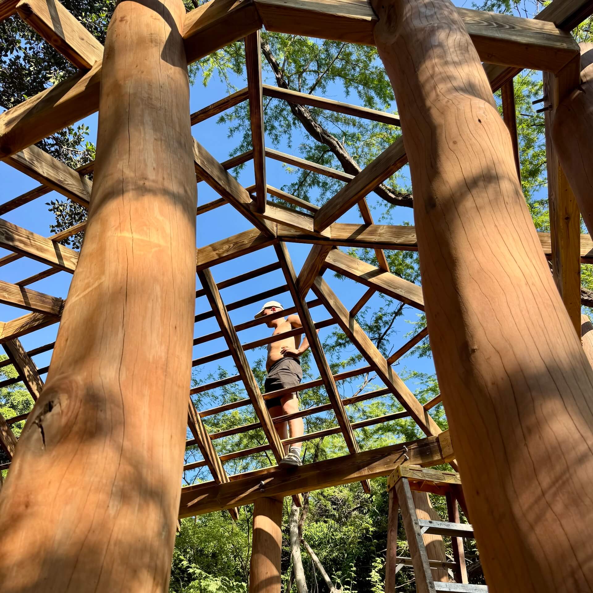 Streetside billboard with flyposters of the Batch.Works brand and illustrations