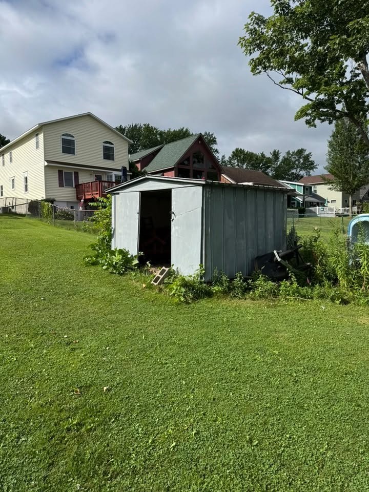 Old backyard shed before removal by GroundBreaking Excavation