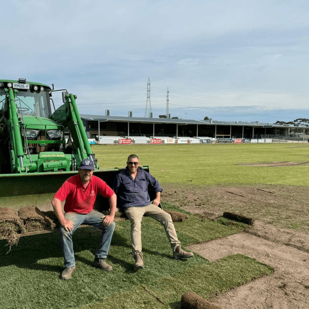 Volunteer groundskeepers maintaining the playing surface at Elcho Park.