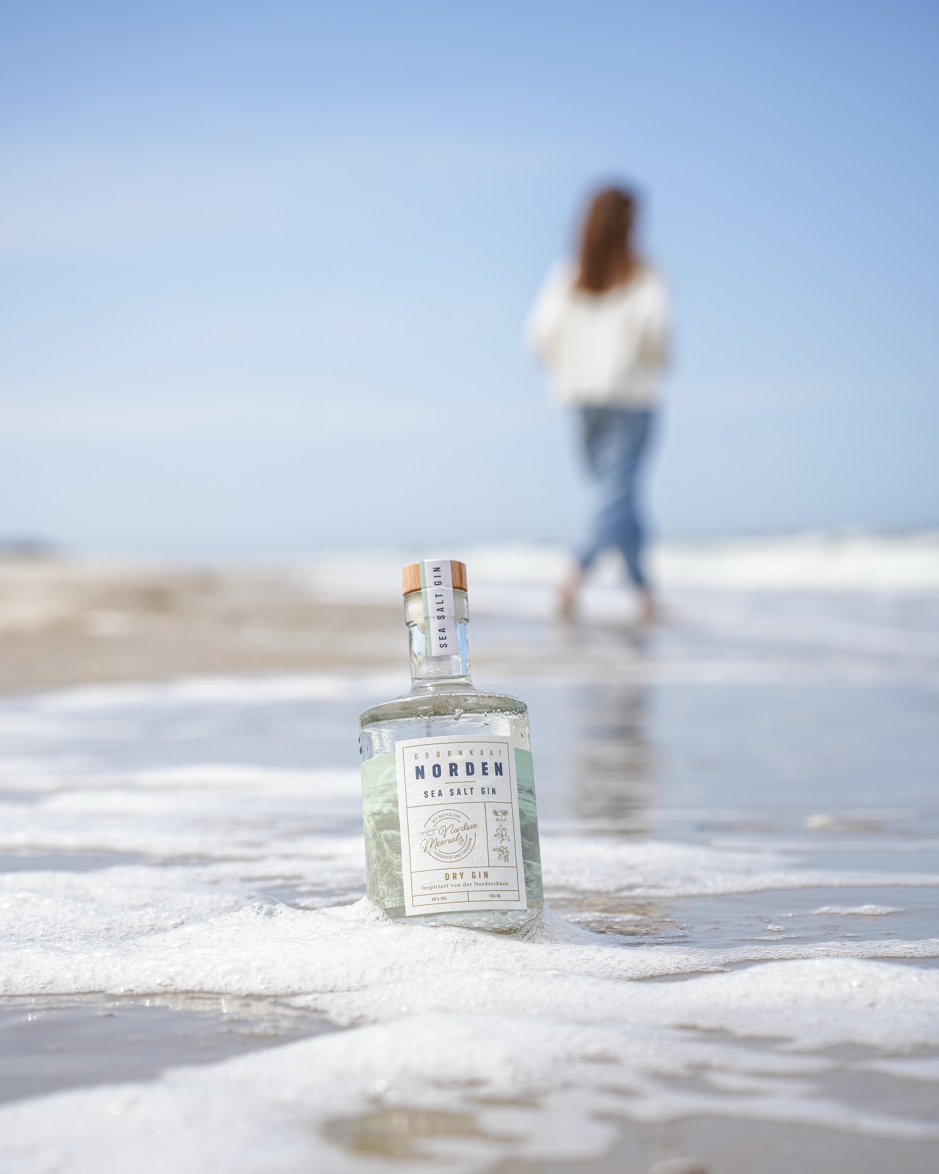 Modern house with wooden deck in snowy landscape