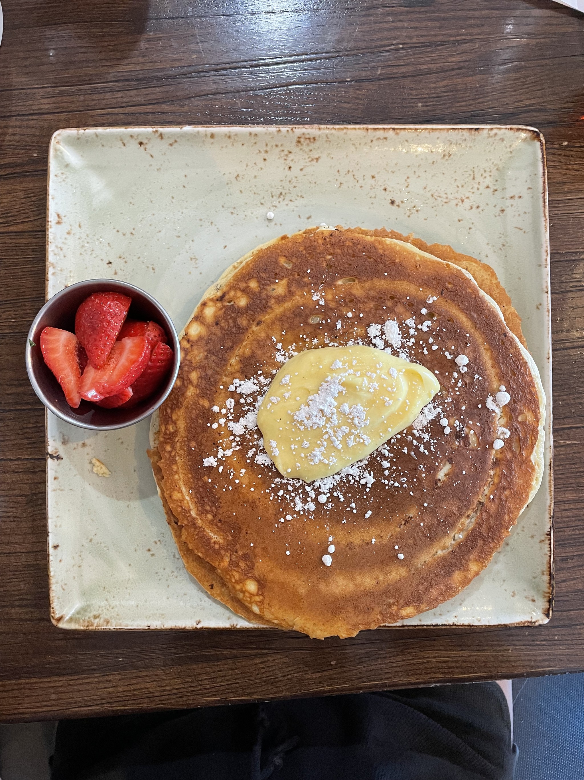 Lemon ricotta pancakes with a side of strawberries