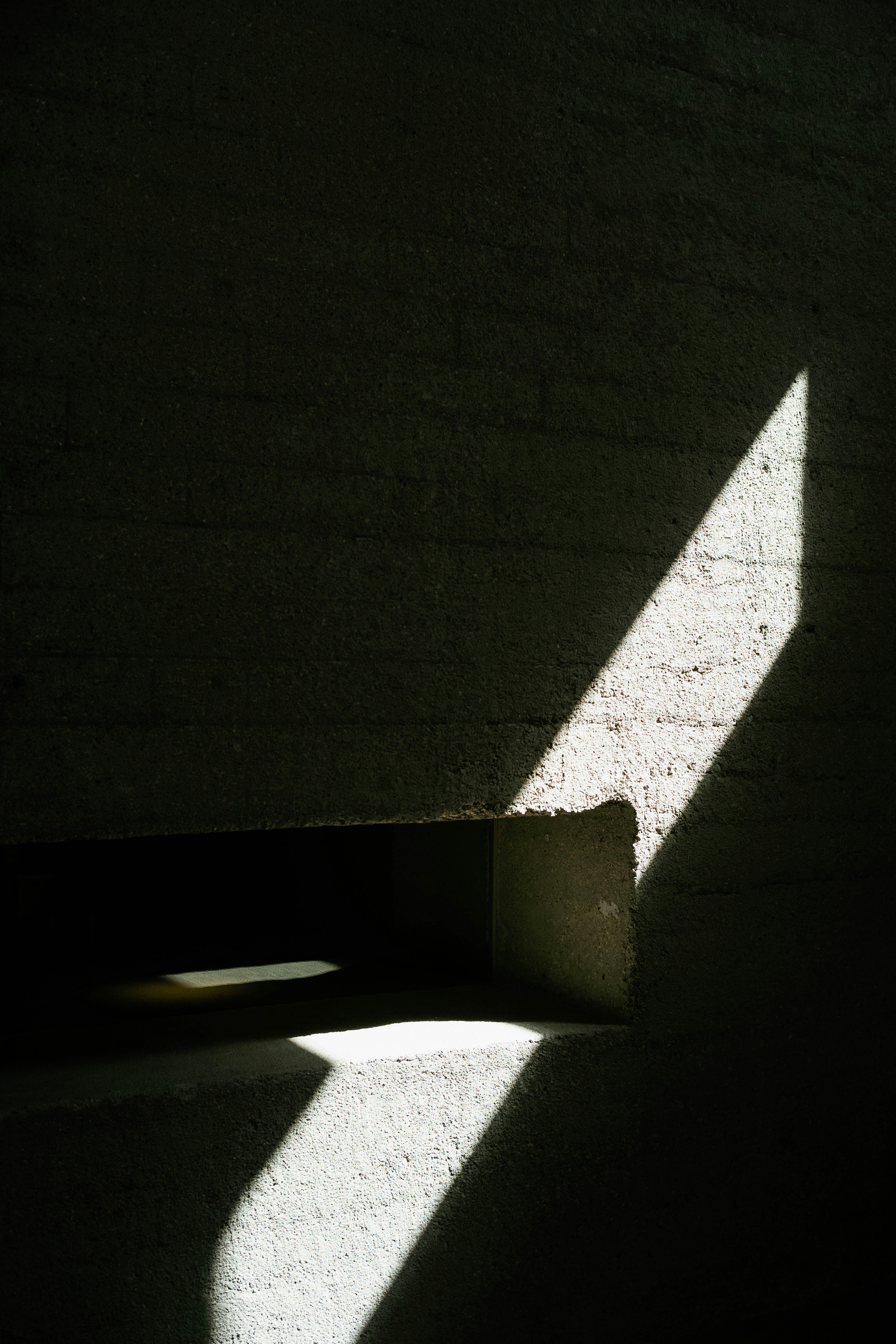 the shadow of a window on a wall