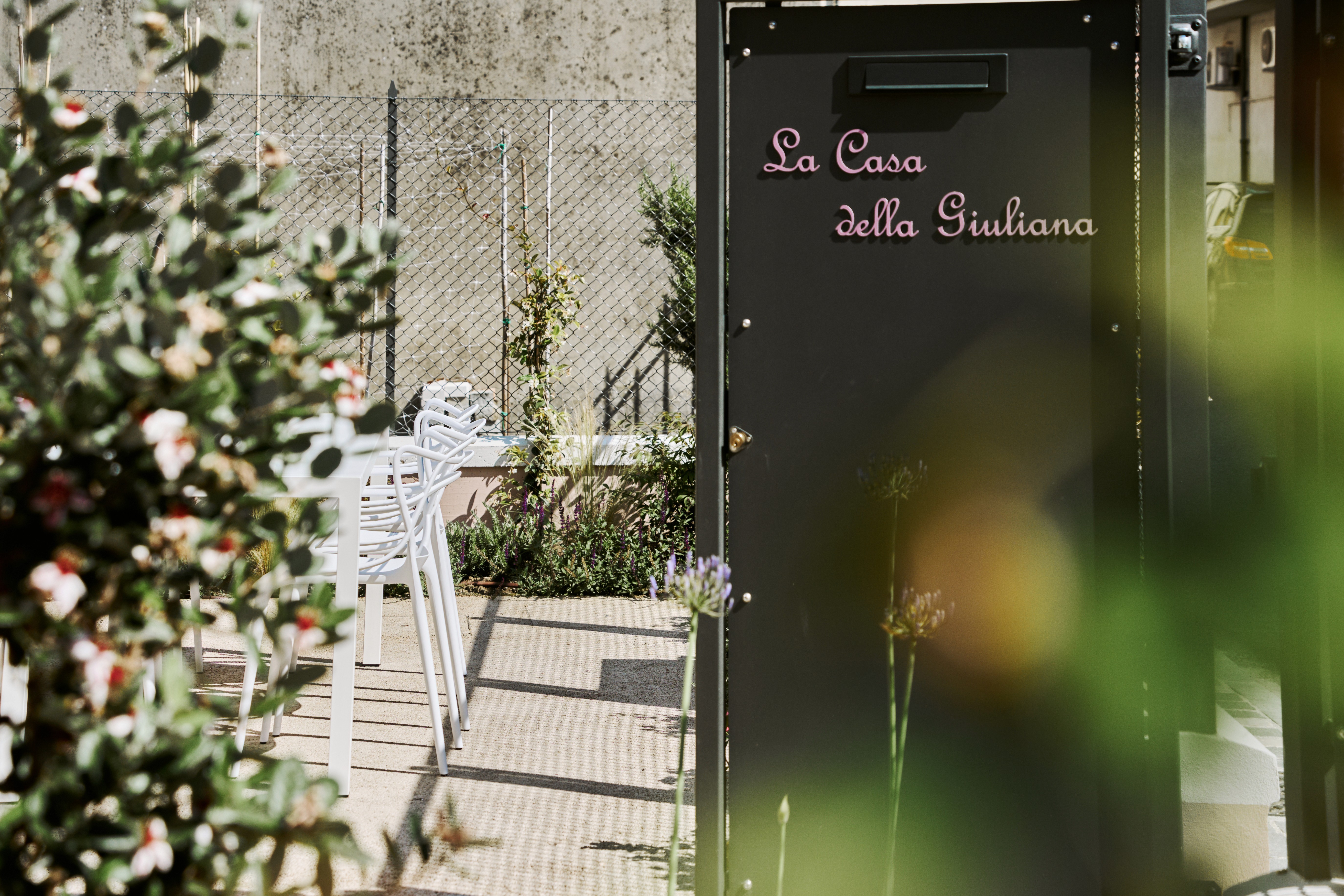 A close-up of hands performing a soothing massage on a client’s back, with warm golden light illuminating the skin. The scene evokes relaxation and well-being.