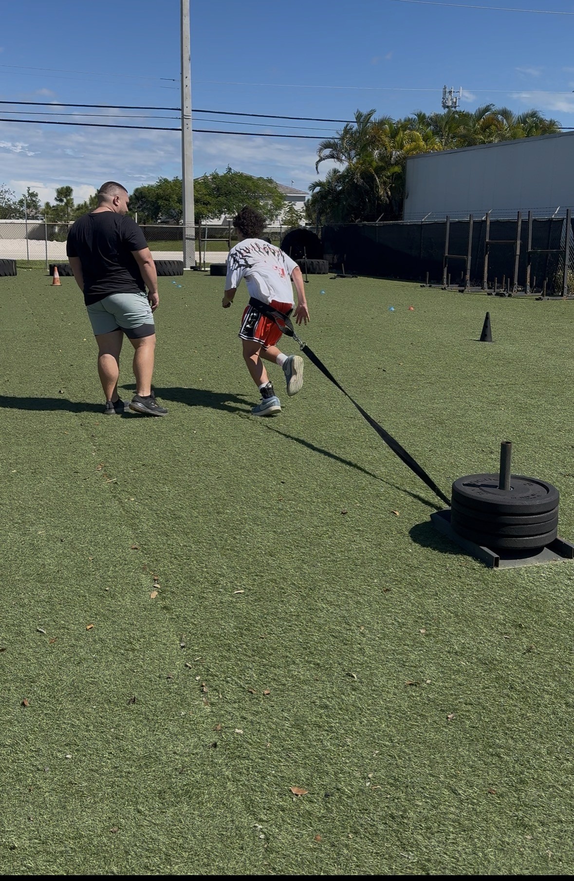 Football player sprinting toward the end zone during a game, showcasing explosive speed and strength—ideal focus for sports injury rehab and athletic performance training.
