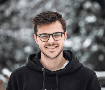 man in black hoodie wearing black framed eyeglasses