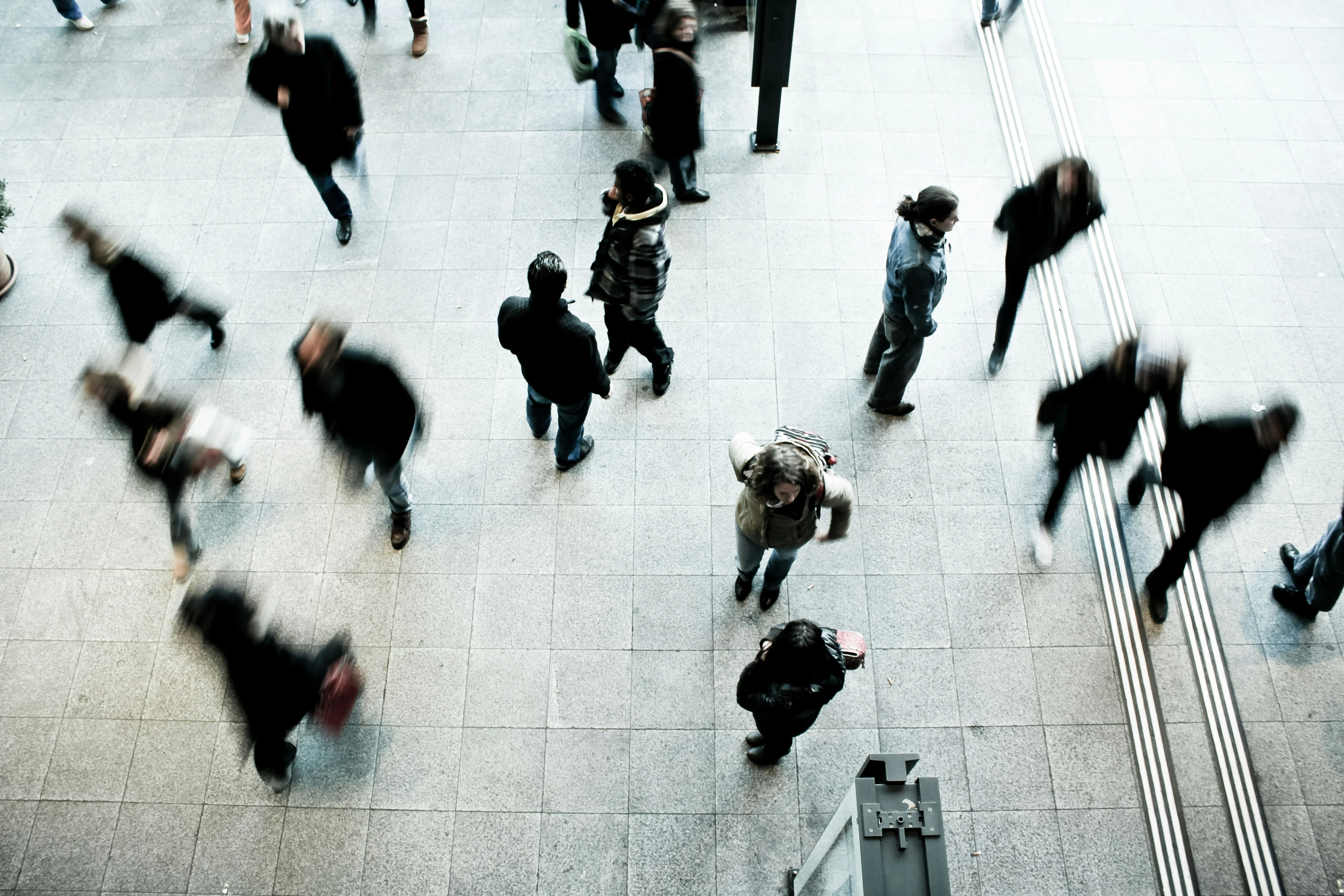 people walking on gray concrete floor during daytime