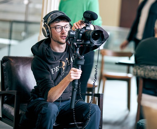 Camera operator holding a camera