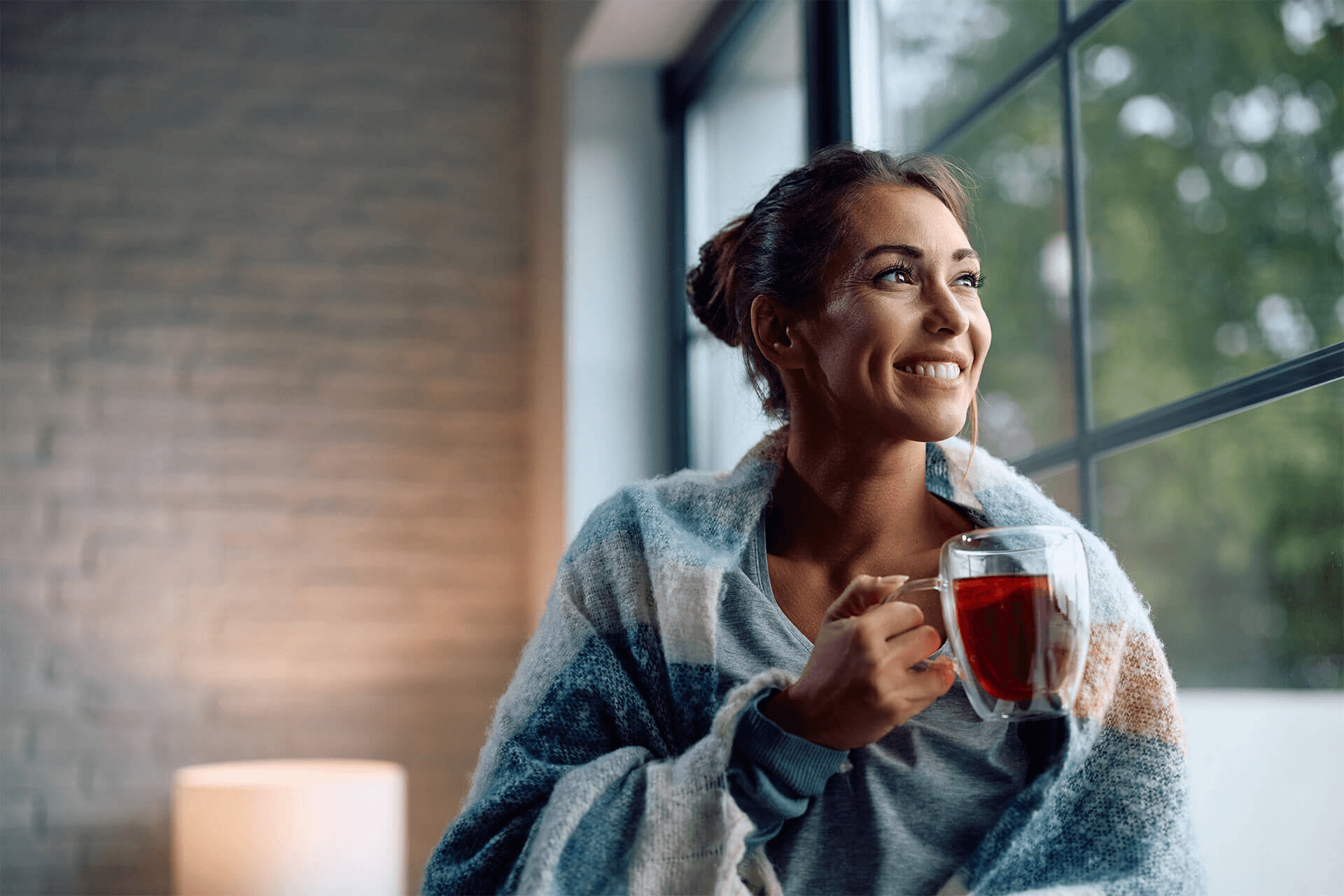 a woman holding tea mug