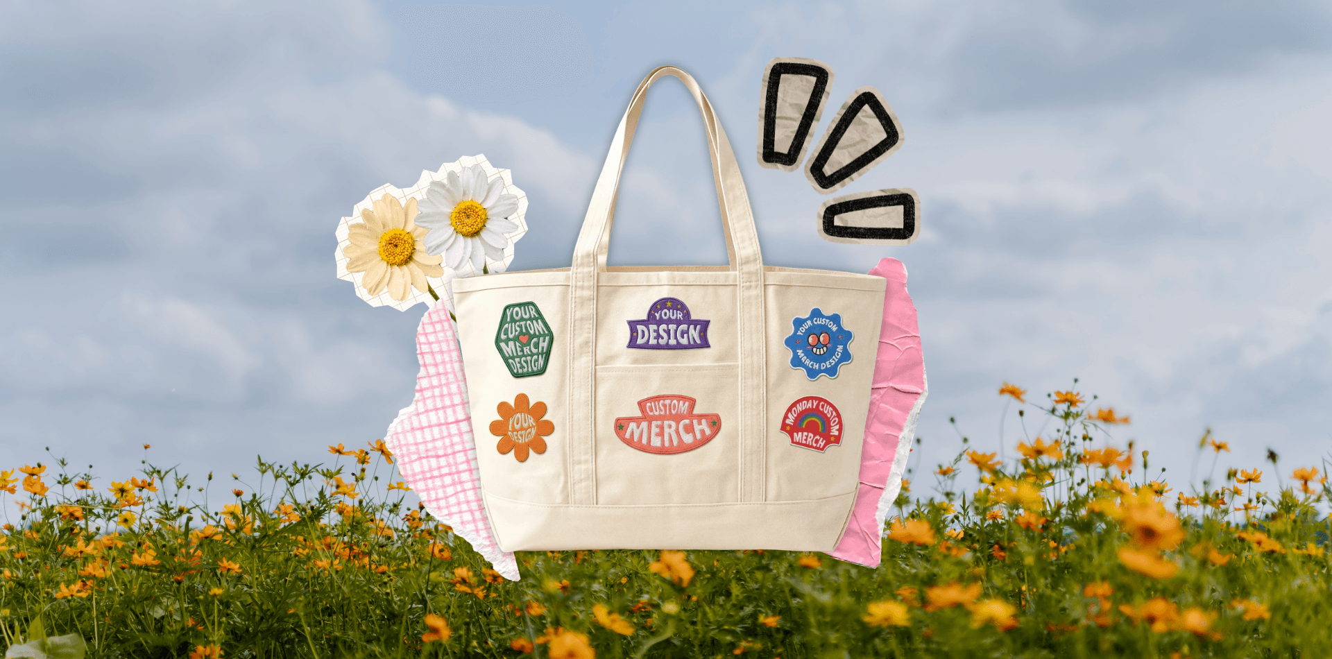 Cream custom tote bag decorated with colorful branded patches, displayed outdoors among flowers.