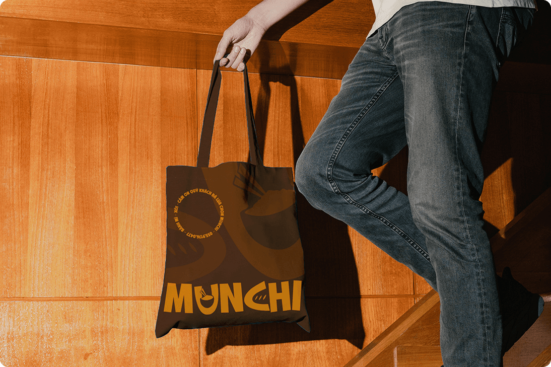 White branded cap with turquoise logo placed on fresh lemons in a red bowl