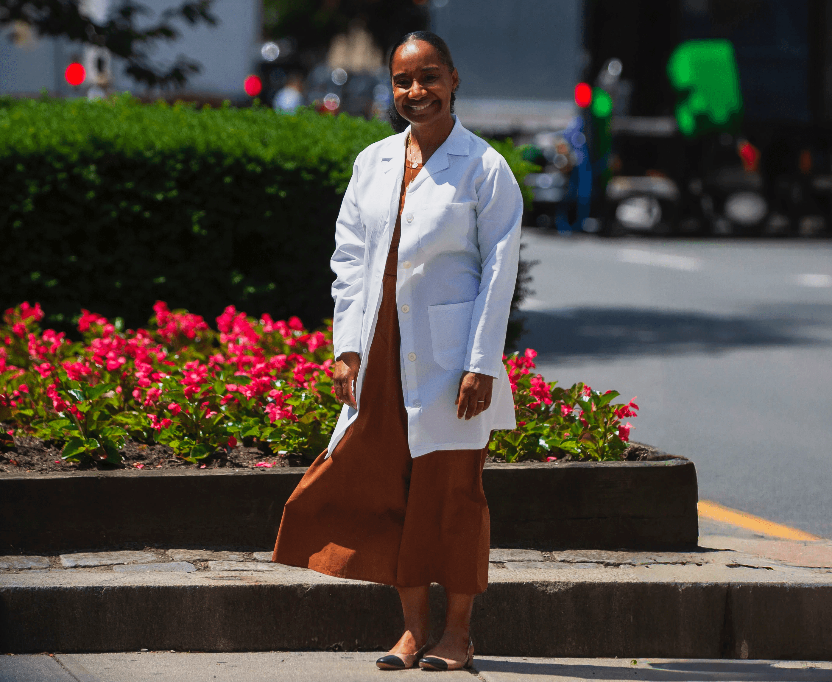 Portrait of a woman with long red hair gently touching her face, looking into the camera