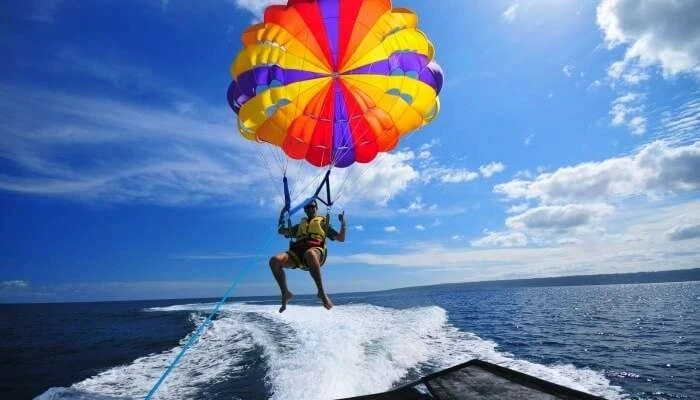 Colorful parasailing over ocean