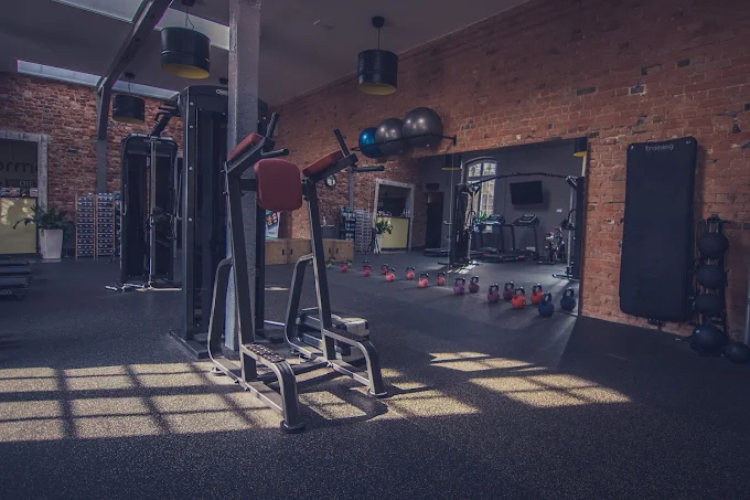 Premium dark gym interior with strength equipment