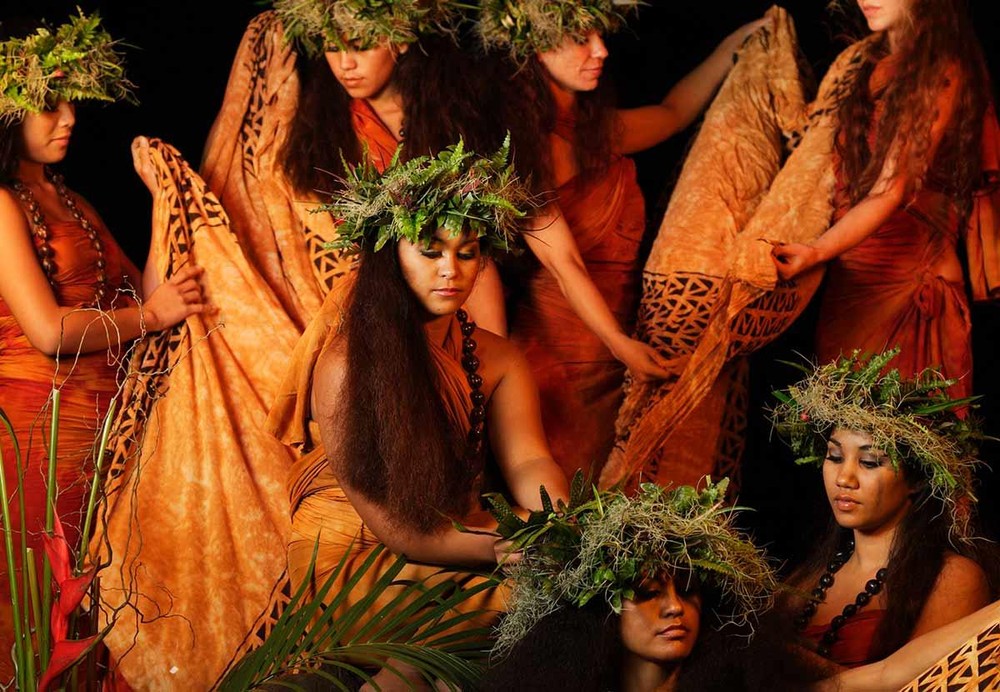 Dancers in traditional attire at Luau Kalamaku cultural show, Hawaii.