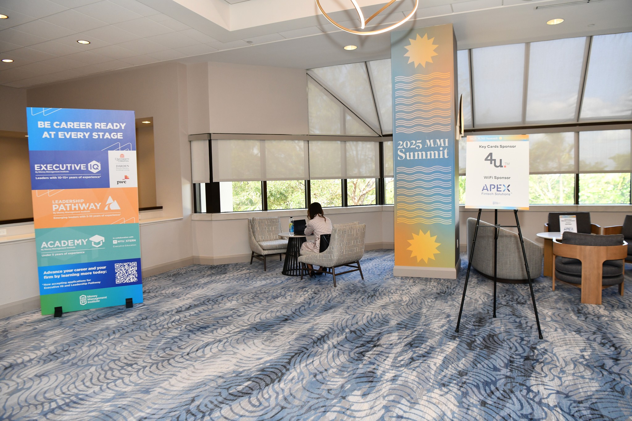 2025 MMI Summit onsite branding vinyl cling on pillar inside of hotel, plus a freestanding meter board advertising MMI initiatives