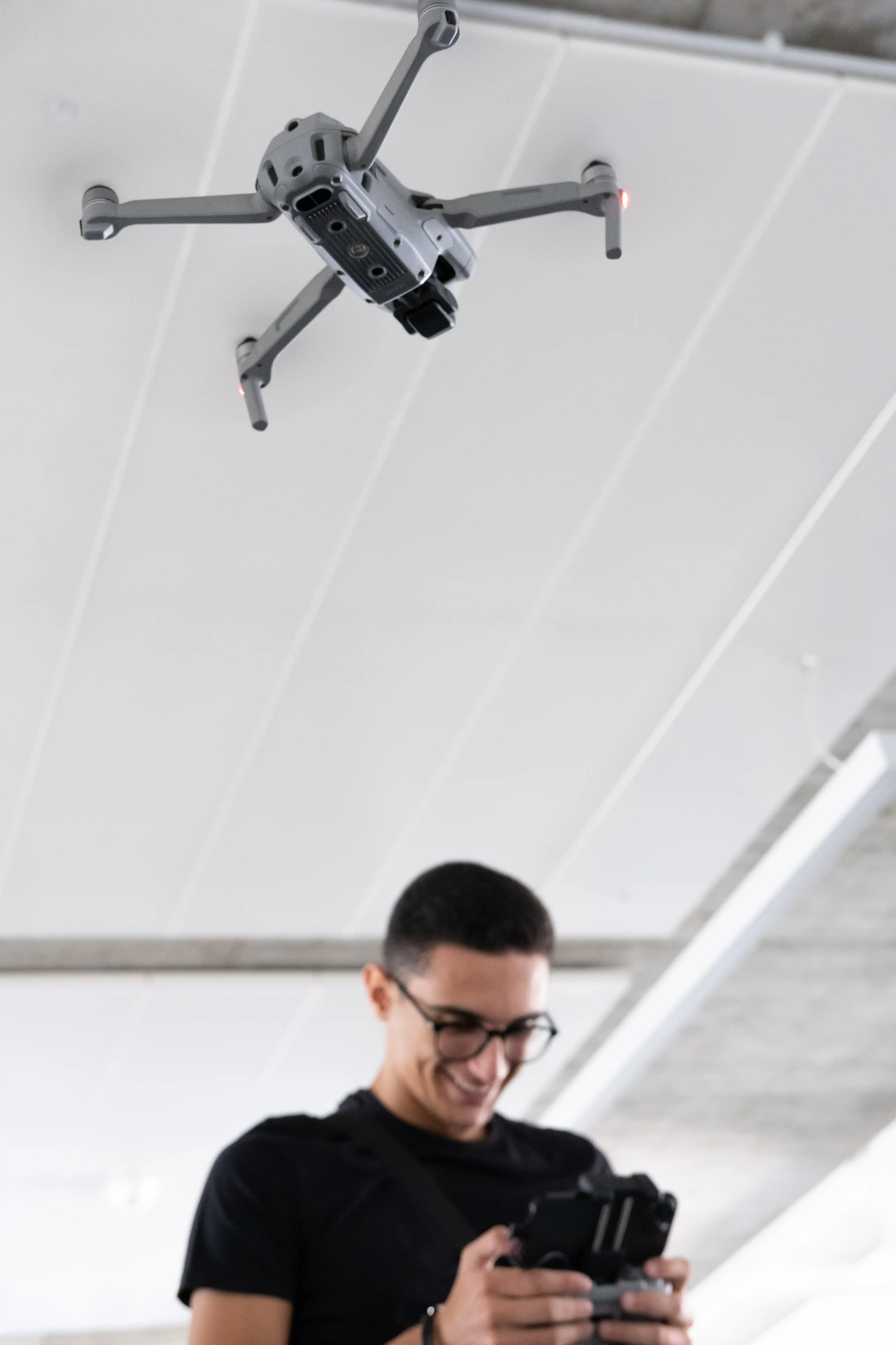 young men flying a drone
