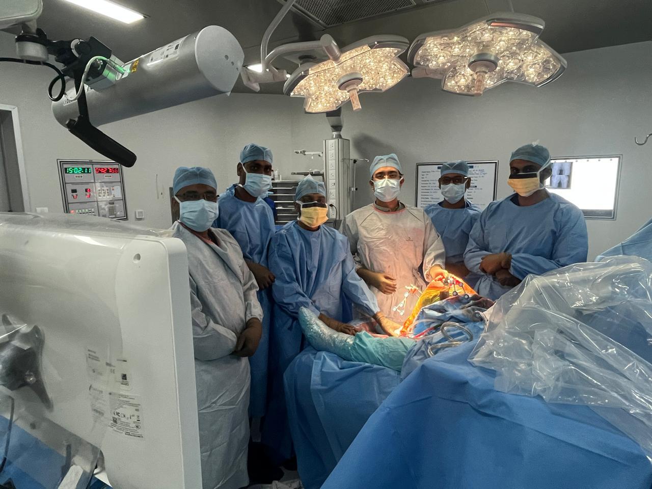 A large gold futuristic tank on a rooftop overlooking a skyscraper city