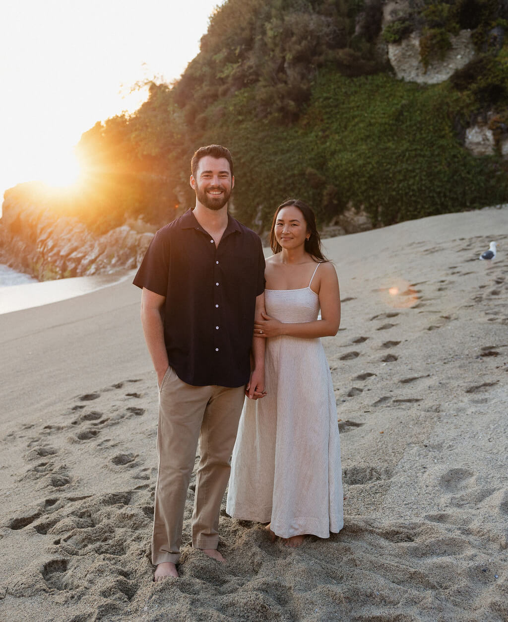Couple portrait with dog on field