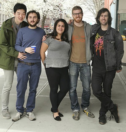 portrait of students outside on the sidewalk
