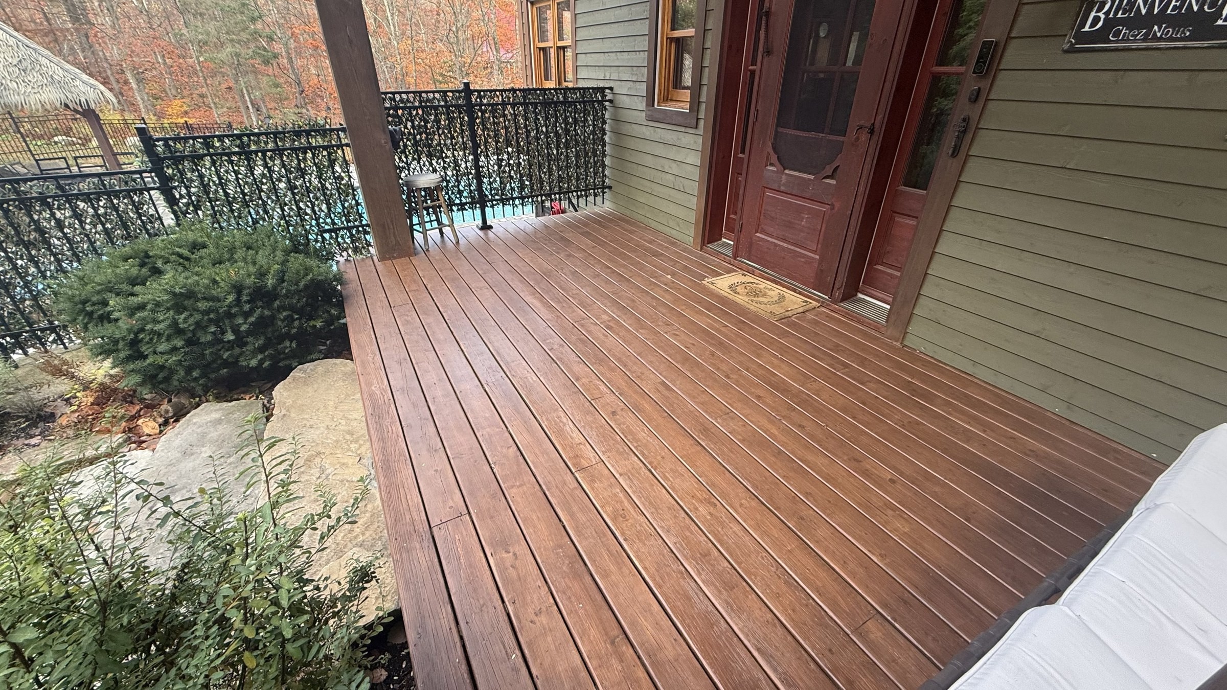 Restored front porch decking after staining