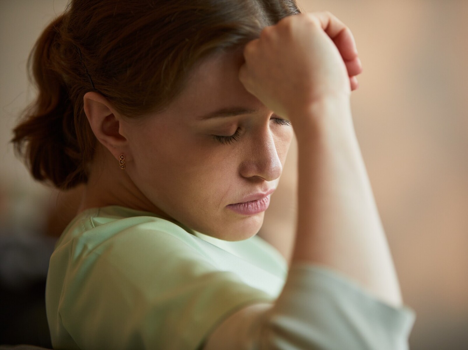 woman feeling fatigued and experiencing weight gain from birth control pills”