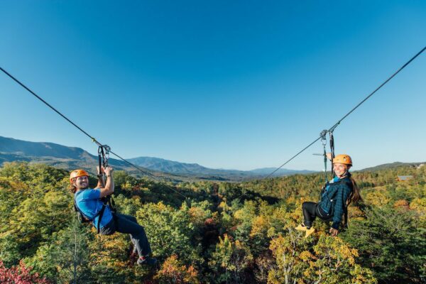 couple on the mountaintop zipline in gatlinburg