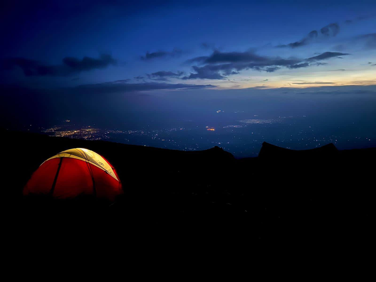 Majestic sandstone formations in AlUla glowing under the afternoon sun, showcasing the desert’s timeless beauty.