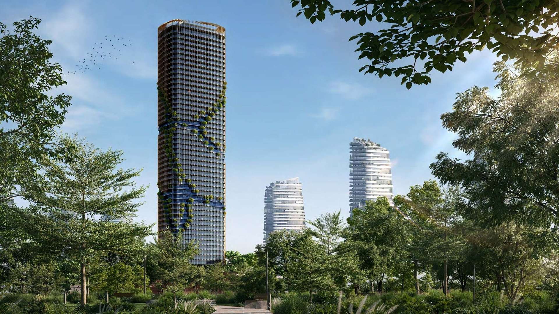 A tower stands amidst lush trees and grass in a serene kanyon setting.