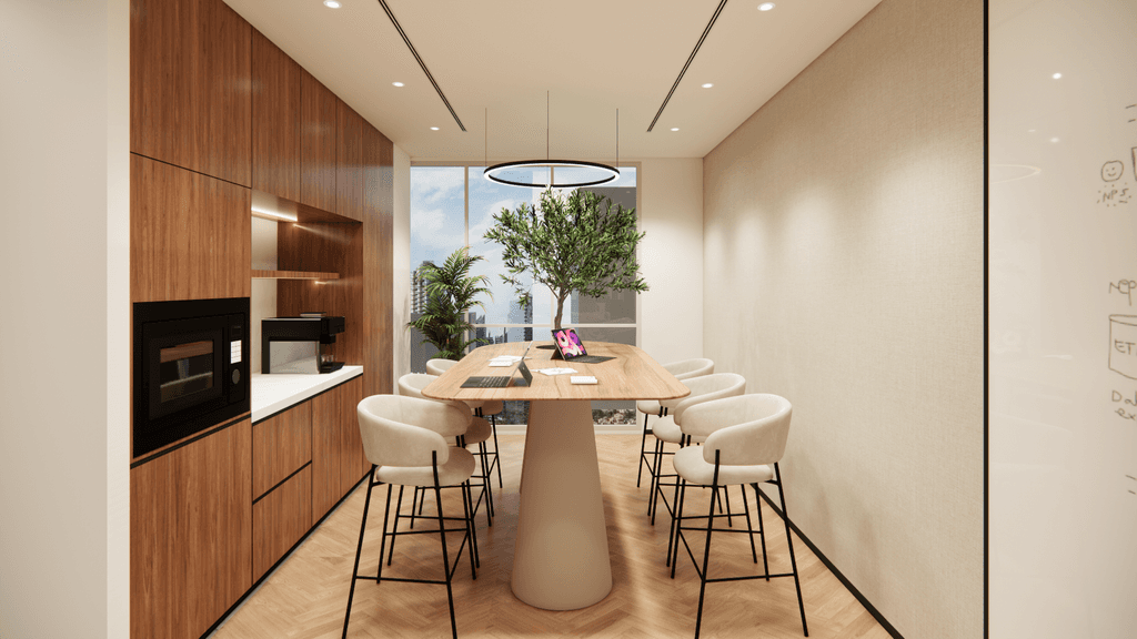 Dedicated pantry area featuring premium coffee stations, modern appliances, and a relaxed seating layout. 
