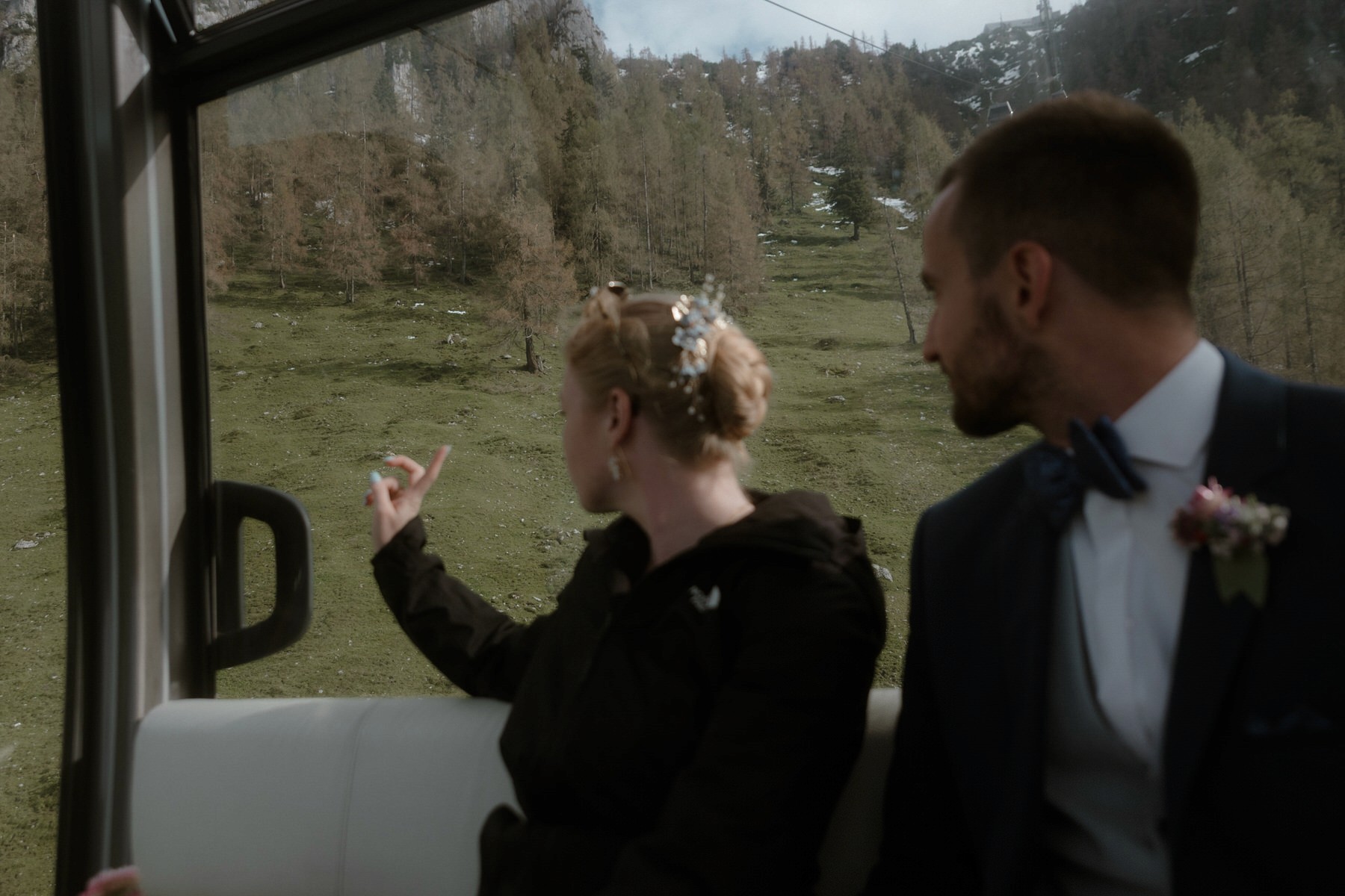 elopement couple taking the Jennerbahn gondola down the mountain