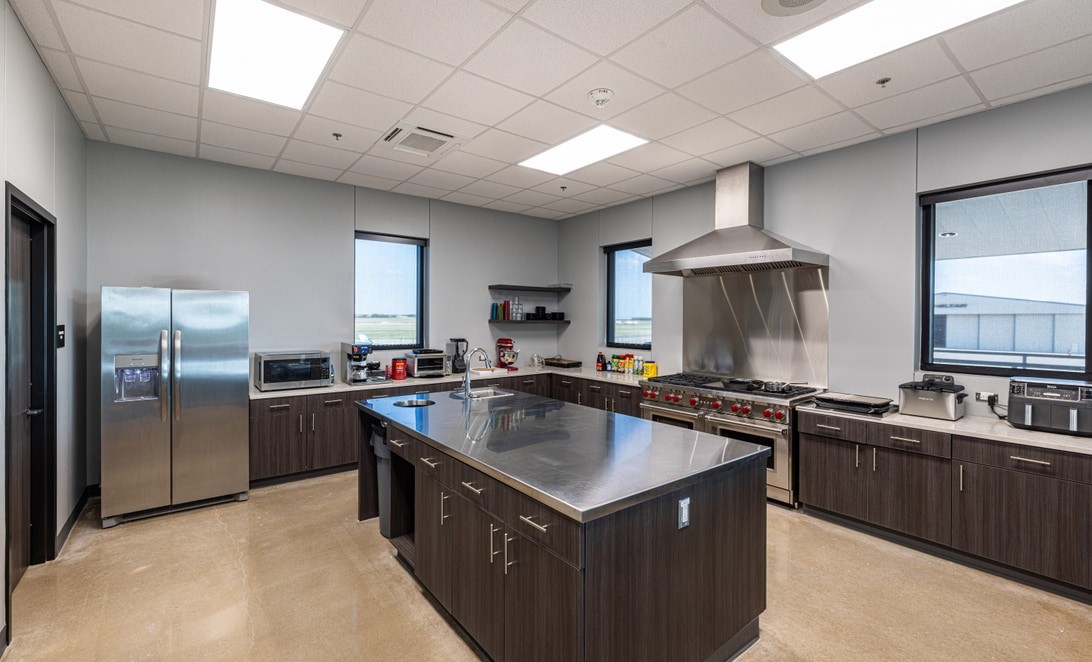 Firehouse commercial kitchen with stainless island at Denton Fire Station 9, by Martinez Architects
and Parkhill