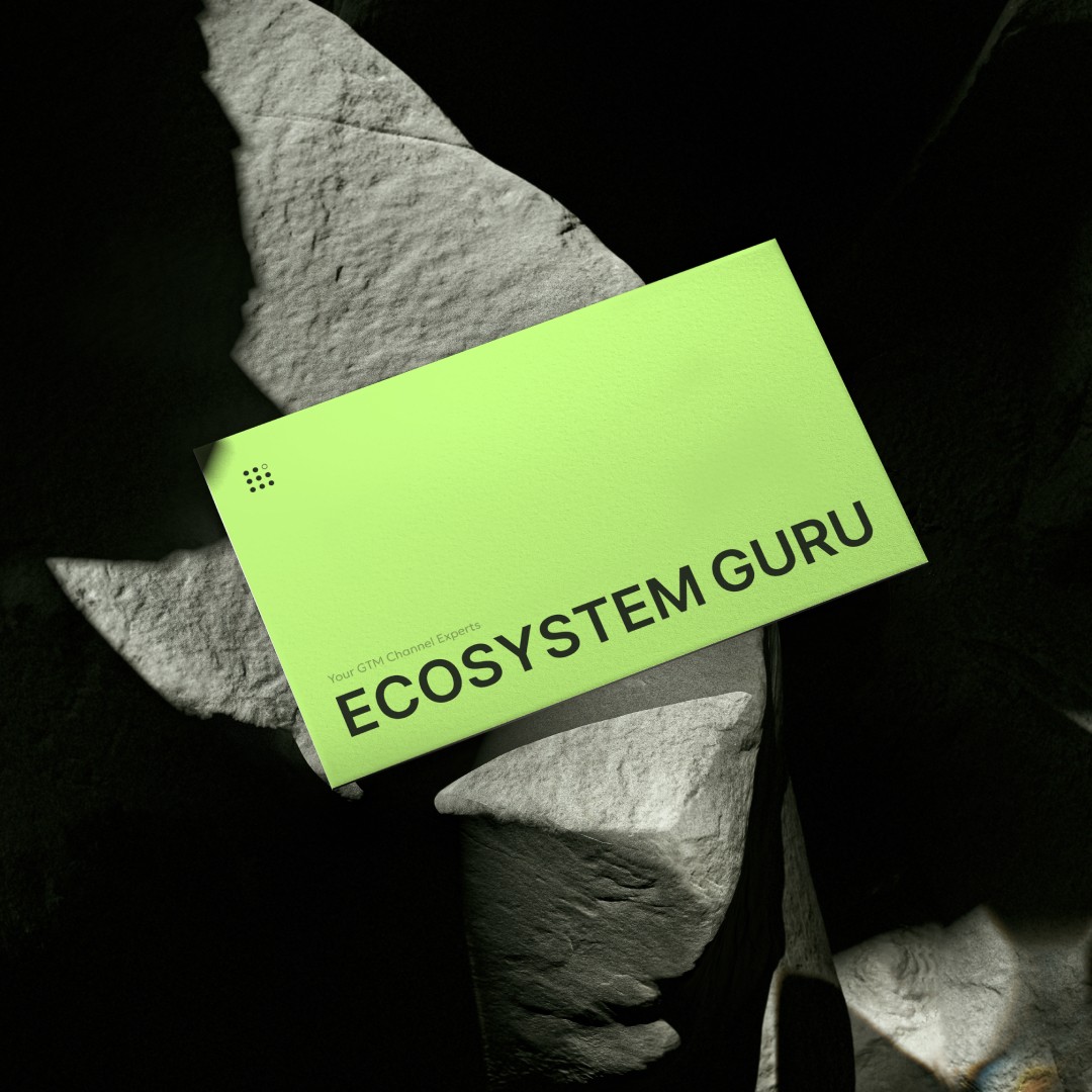 Modern home office setup with a monitor, ergonomic chair, keyboard, and indoor plants near a window with blinds.