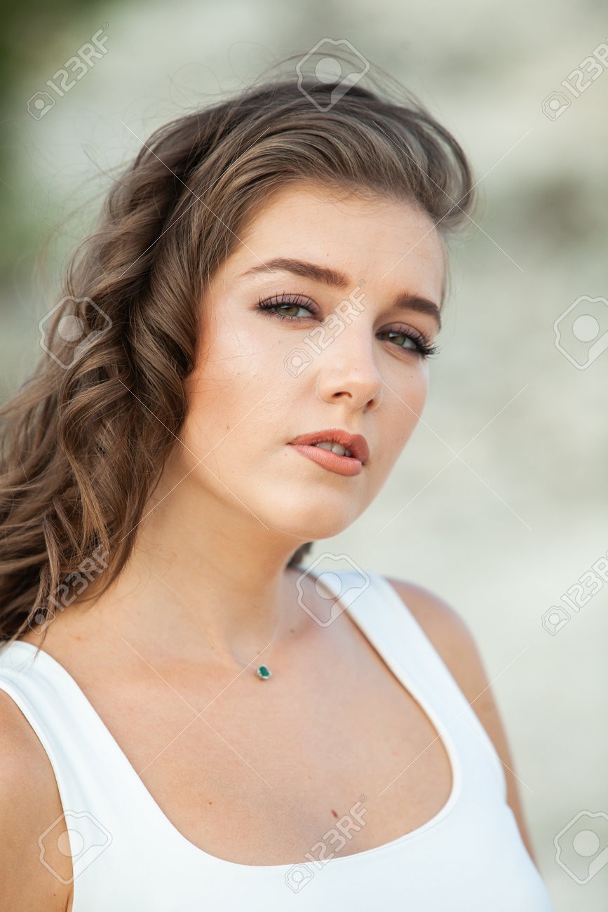 Woman wearing bright red sunglasses.