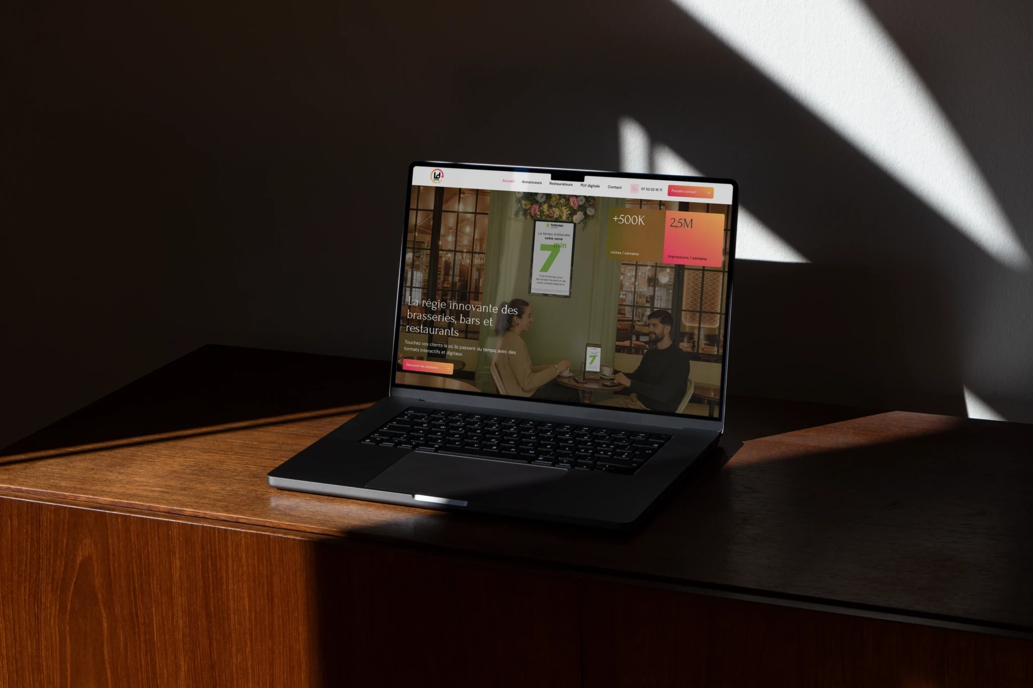 Black patent leather shoes and wide-leg pants stand on a deep red carpet, conveying a sense of elegance and sophistication.