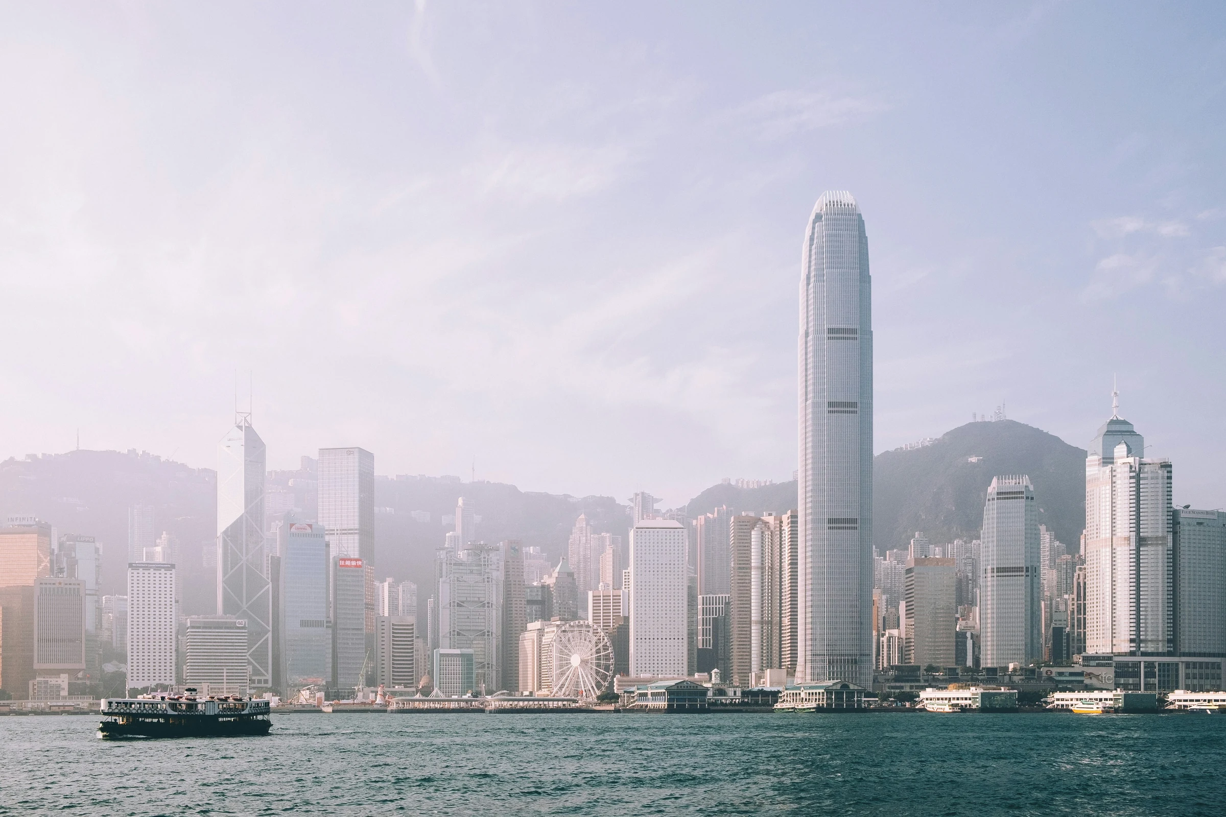 Hong Kong Island skyline and a Star Ferry crossing Victoria Harbour.