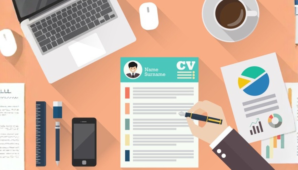 Illustration of a workspace with a CV document being filled out by hand, surrounded by a laptop, coffee cup, smartphone, and colorful charts, representing resume writing, templates, and examples for building a FAANG‑ready resume.