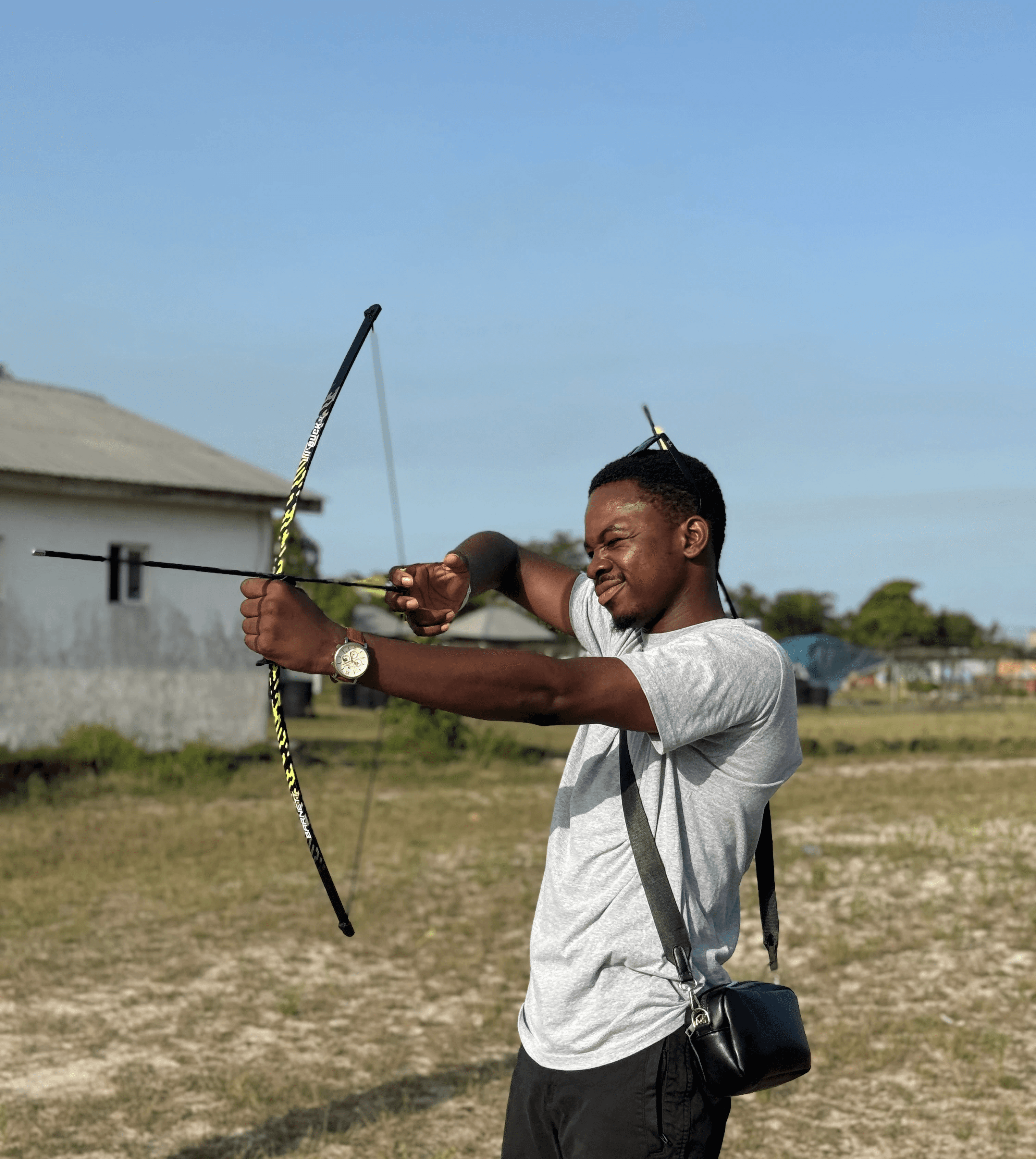 A close-up of a pink cocktail in a martini glass, set against a nighttime background with soft, blurred colors.