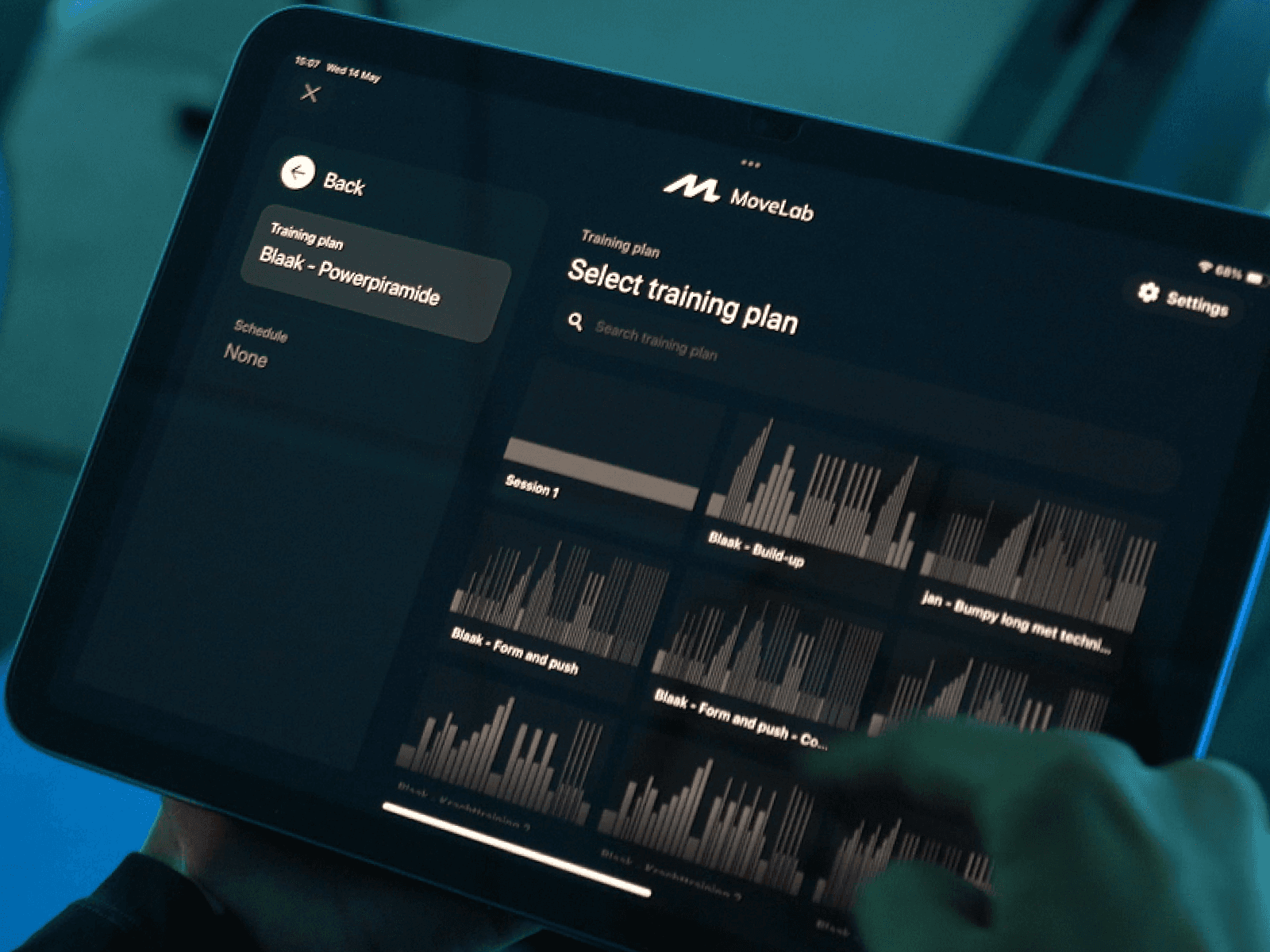 Tablet meant for the coach of the indoor rowing class where they can choose from a library of predesigned workouts for the lesson.