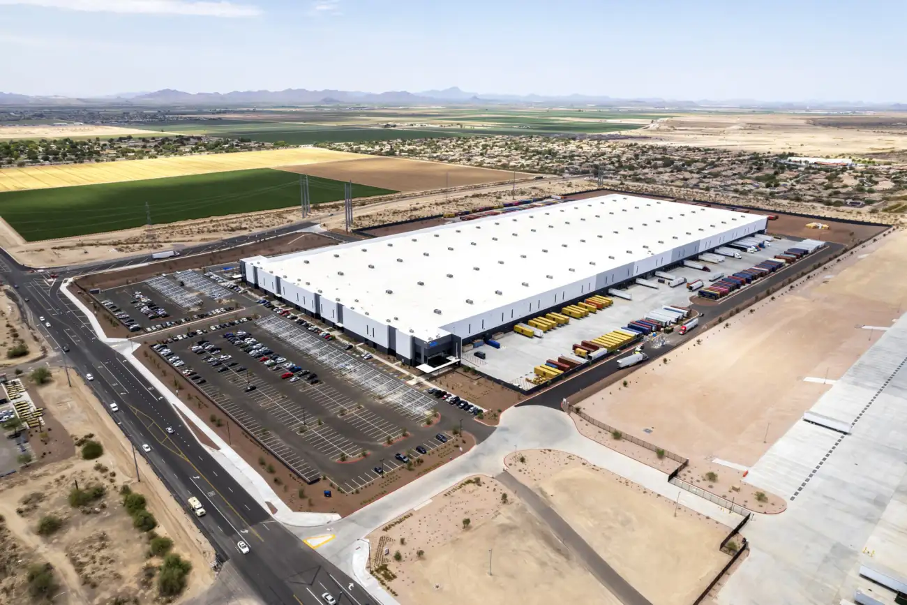 Loading docks at 10 West Commerce with containers, trailers and blue shade sails in Buckeye, Arizona