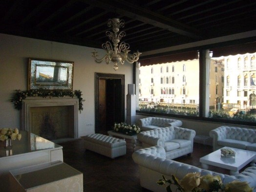 living room fireplace with white couches