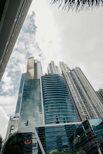 Skyscraper set against a bright blue sky.