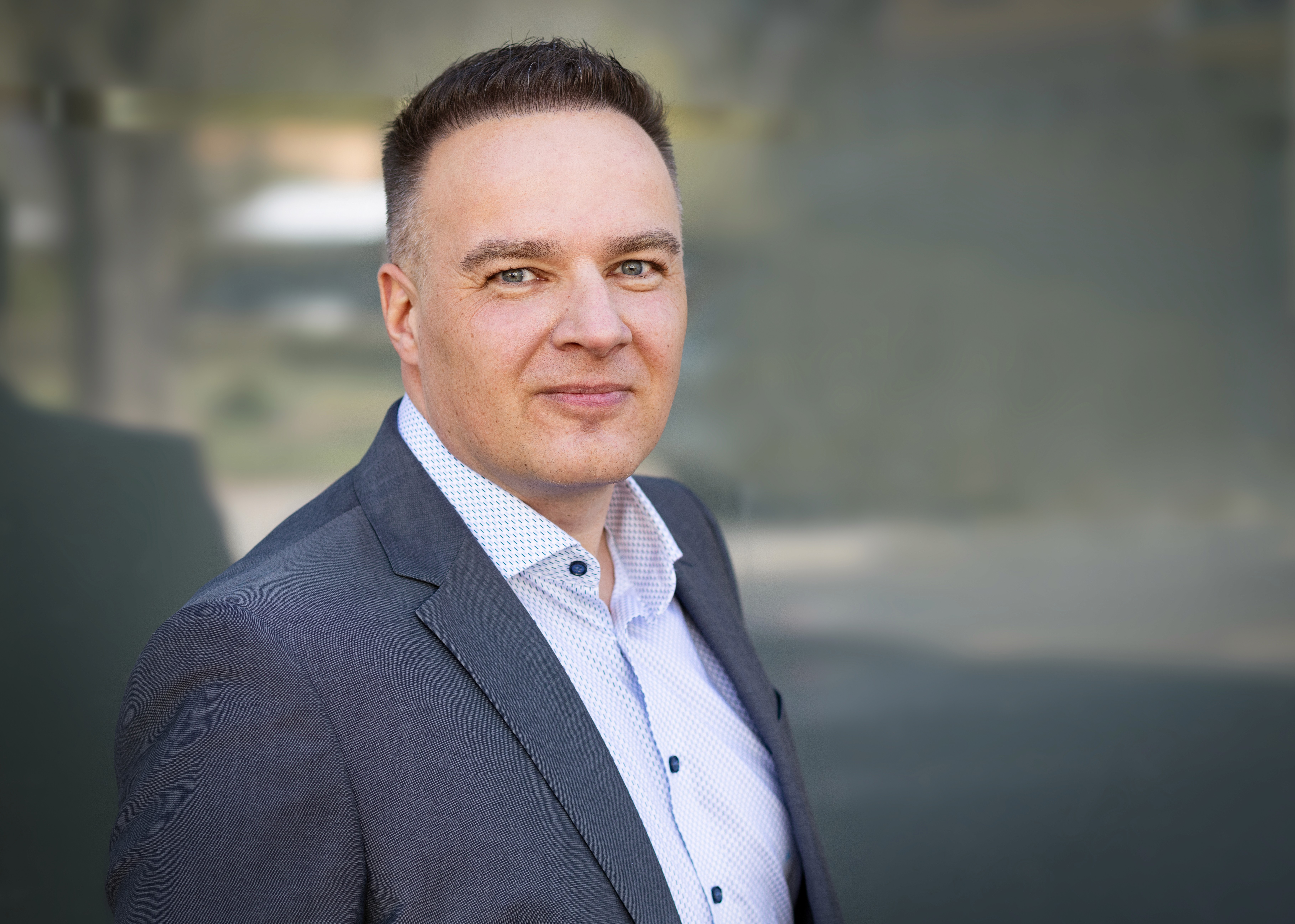 person sitting in a chair in front of a man