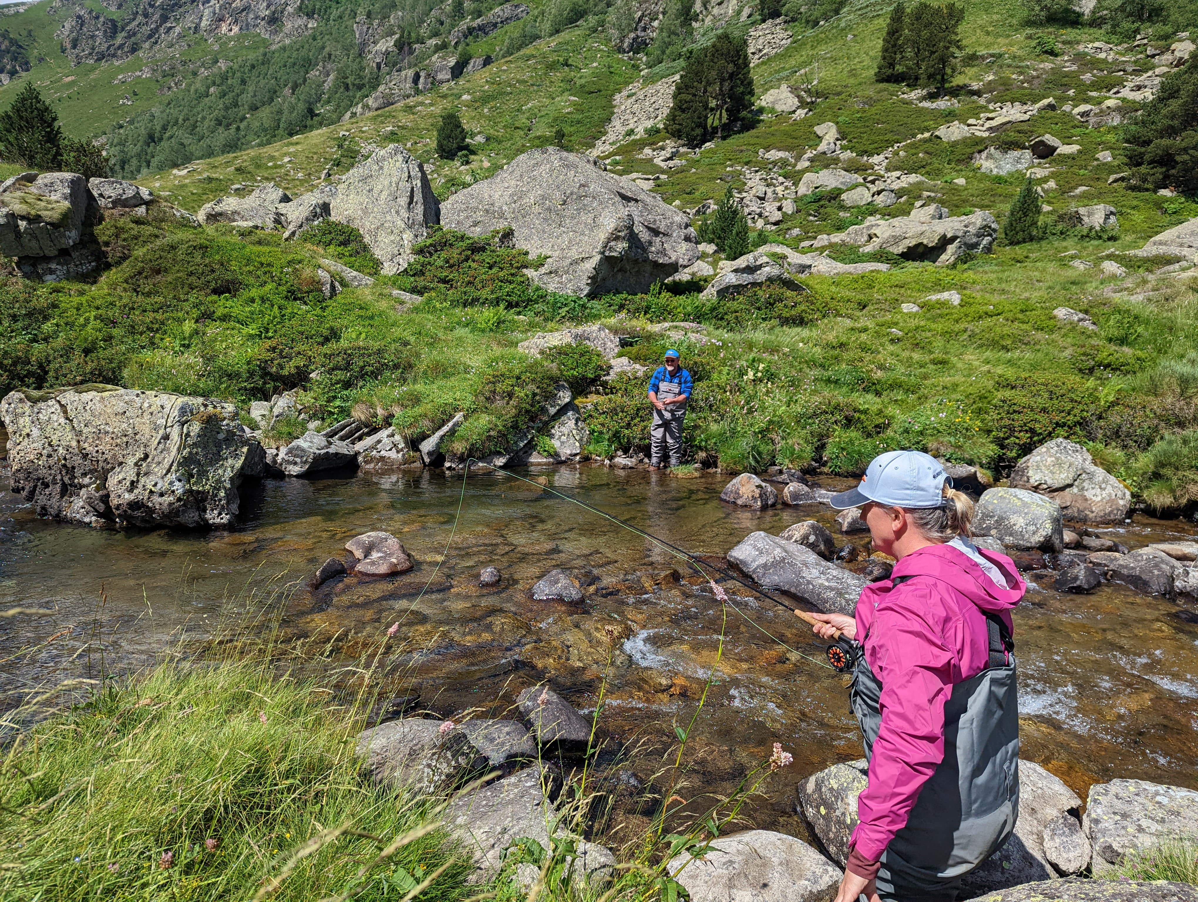 Big fish fishing Pyrenees: reeling in a large catch in the remote Pyrenees.