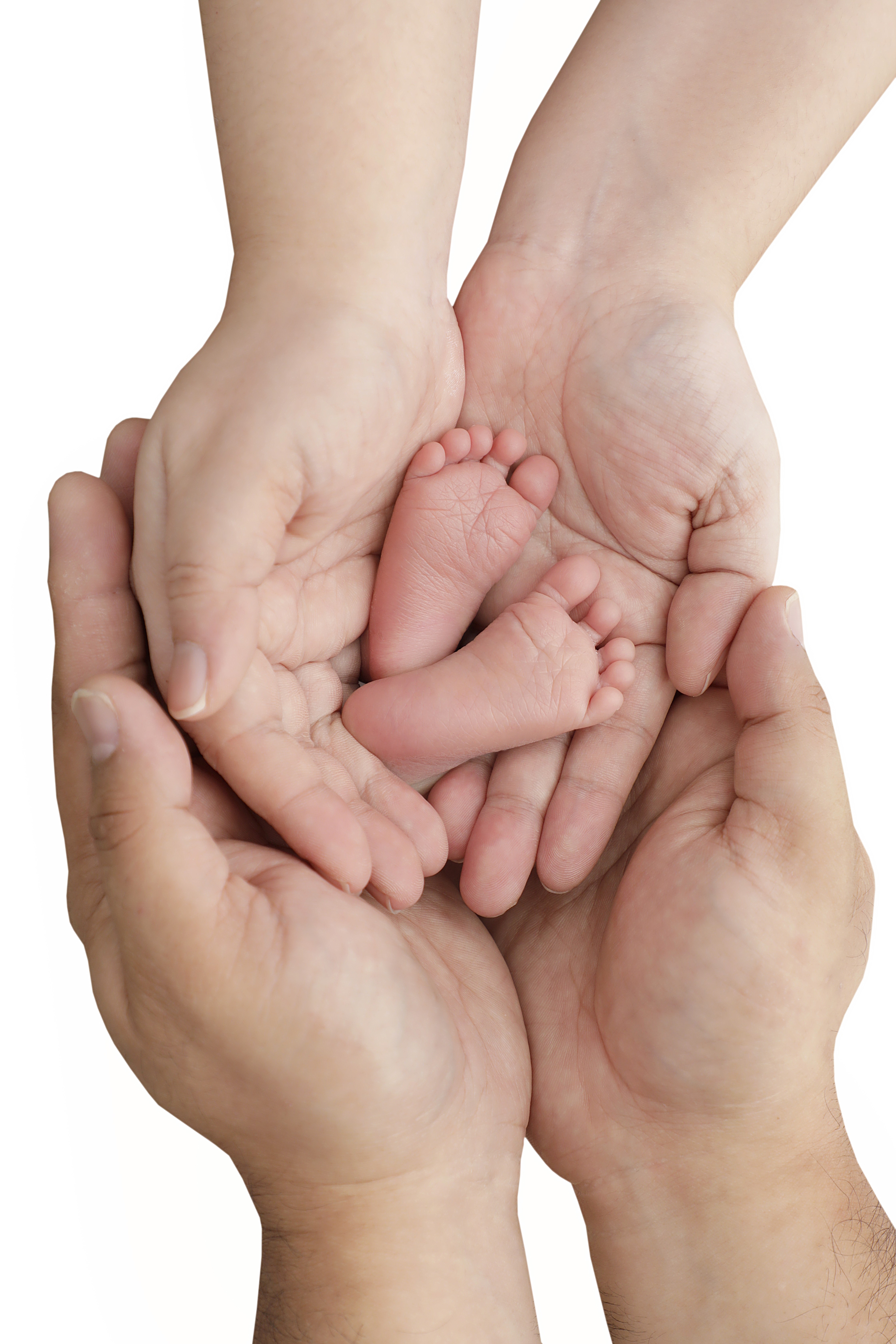Baby's tiny feet gently held by both parents' hands  as a baby photo book idea.
